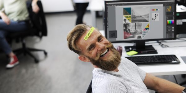 Man Having Be Happy Sticky Note on Forehead During Office Break Time
